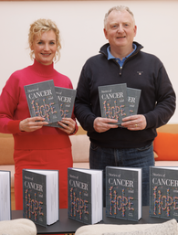 Maggie's staff and Kevin, author of Stories of Hope book, pose with copies of the book
