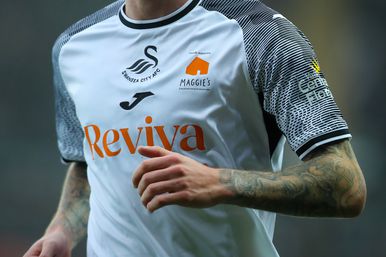 Close up of special Swansea ity home shirt with Maggie's logo